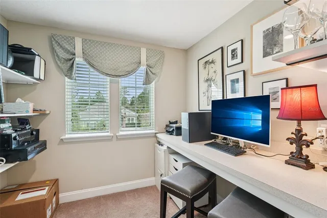 an aerial view of a house with outdoor space