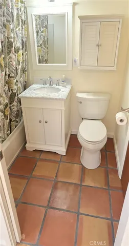 a bathroom with a sink toilet and vanity