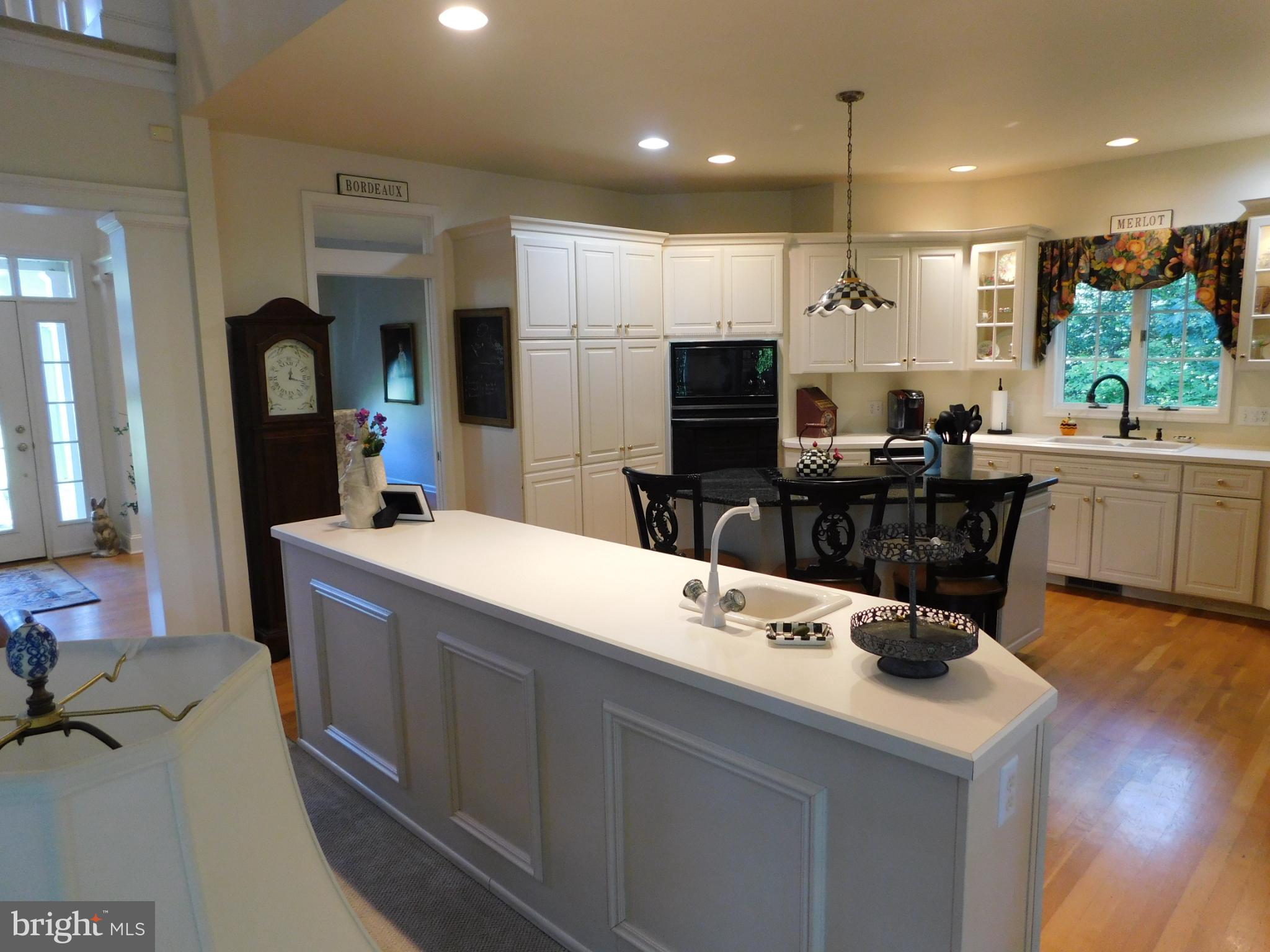28 Baltray Road Dover, DE 19904 - Photo 11 of 73 a kitchen with kitchen island a sink stainless steel appliances and cabinets