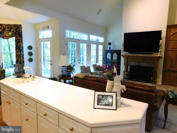 a living room with furniture a window and wooden floor