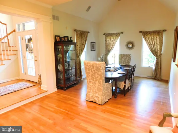 a bathroom with a granite countertop sink a mirror and a window