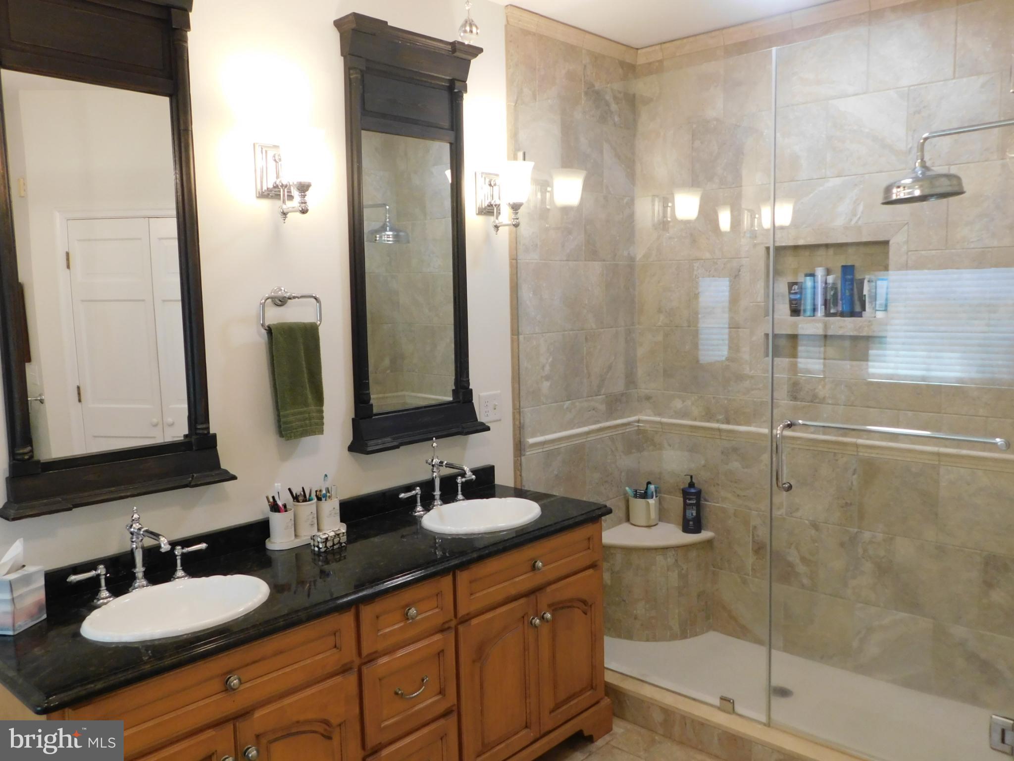 28 Baltray Road Dover, DE 19904 - Photo 32 of 73 a bathroom with double vanity and a mirror