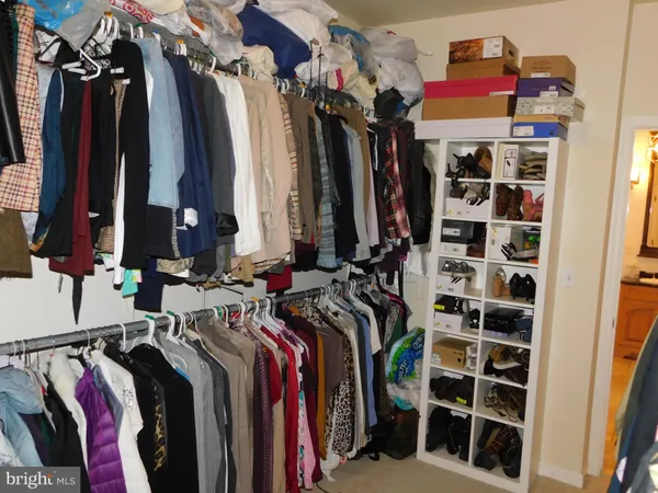 a room with furniture and a chandelier fan