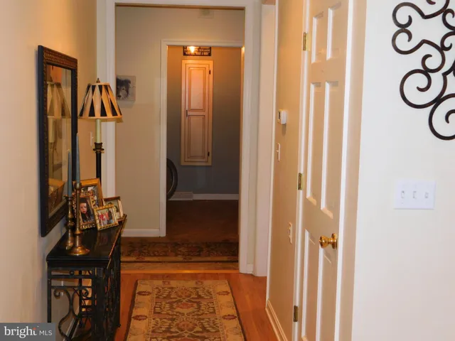 a view of a patio with couches table and chairs and potted plants