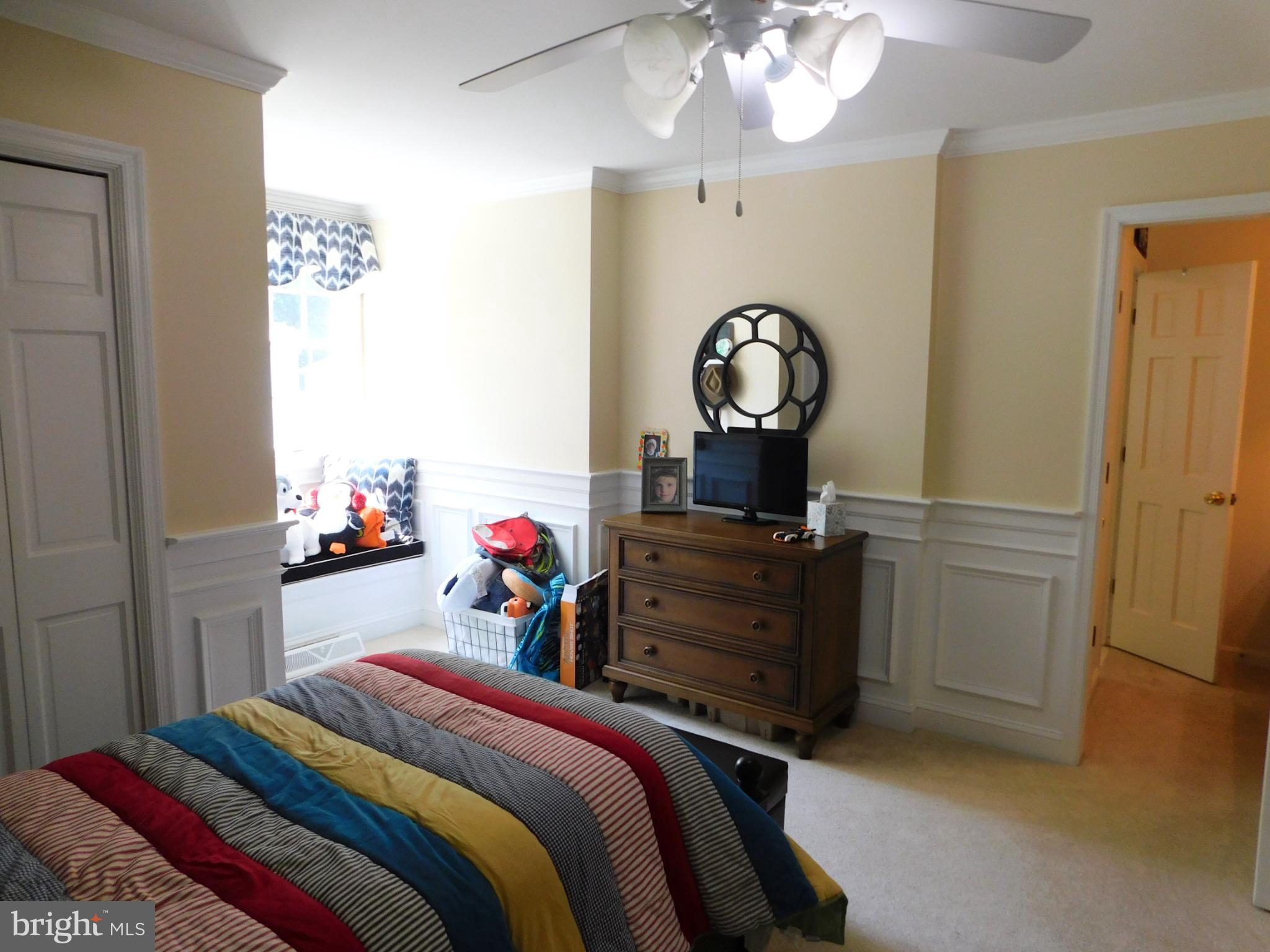 28 Baltray Road Dover, DE 19904 - Photo 45 of 73 a bedroom with a bed and a chandelier