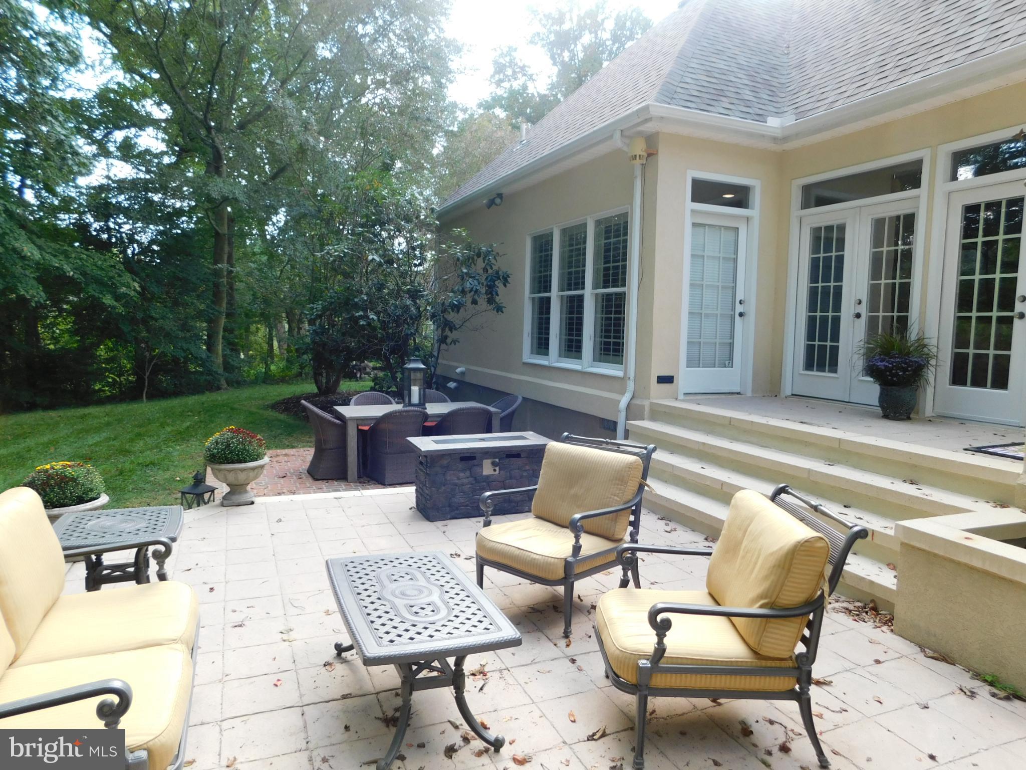 28 Baltray Road Dover, DE 19904 - Photo 58 of 73 a view of a patio with couches table and chairs and potted plants