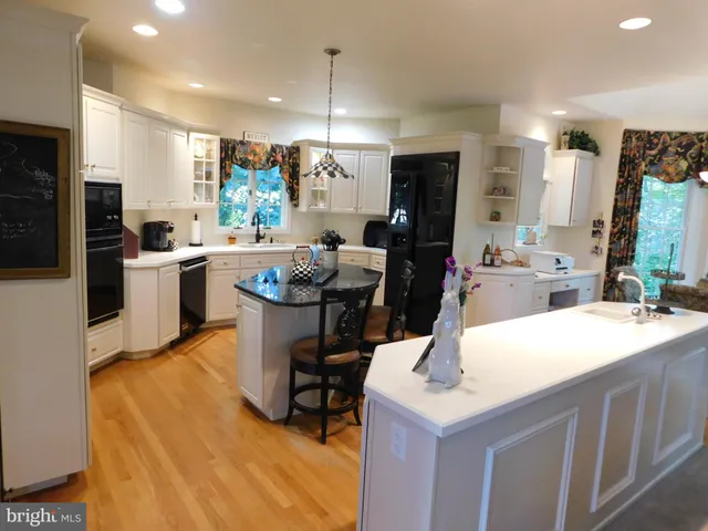 a room with a table chairs and a flat screen tv