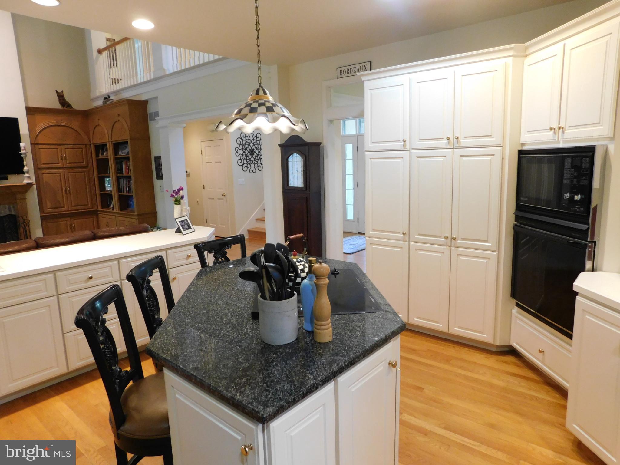 28 Baltray Road Dover, DE 19904 - Photo 8 of 73 a kitchen with stainless steel appliances granite countertop a dining table and chairs