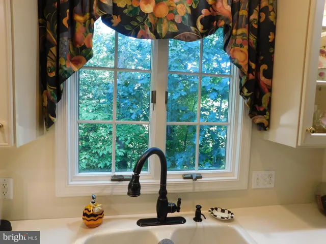 a living room with fireplace furniture and a flat screen tv