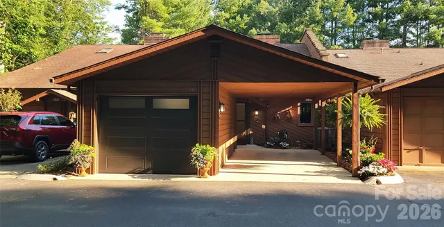 a view of a patio with table and chairs and potted plants