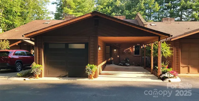 a view of building with glass windows and door