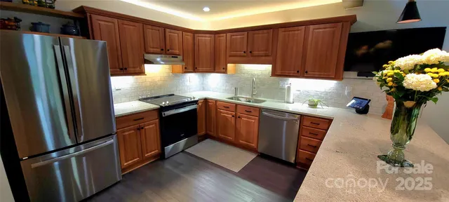 a kitchen with a sink stove and cabinets