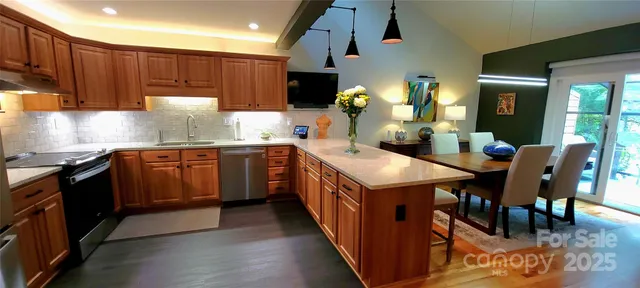 a view of living room with furniture and a garden