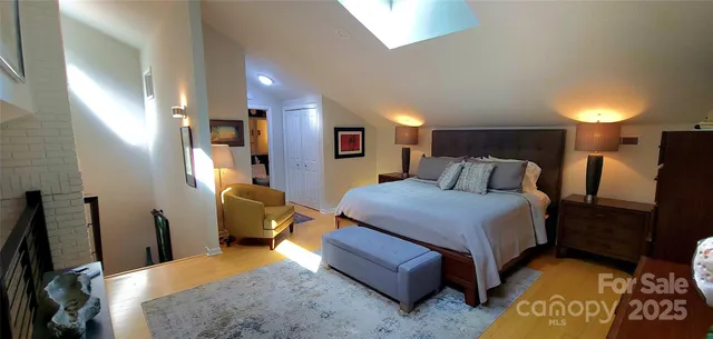 a bedroom with bed and a window