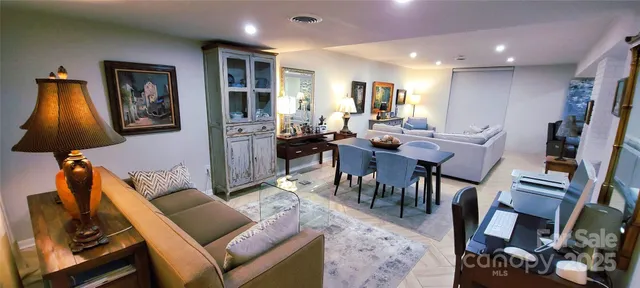 a view of a chairs and table in backyard