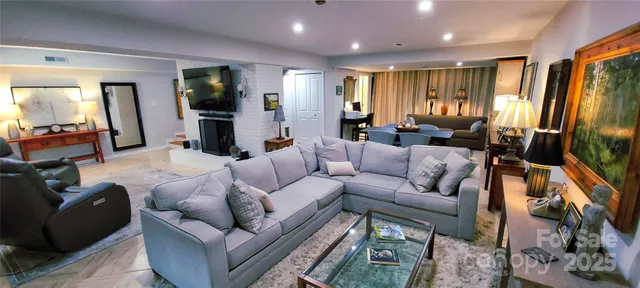 a front view of a house with a yard and a fireplace