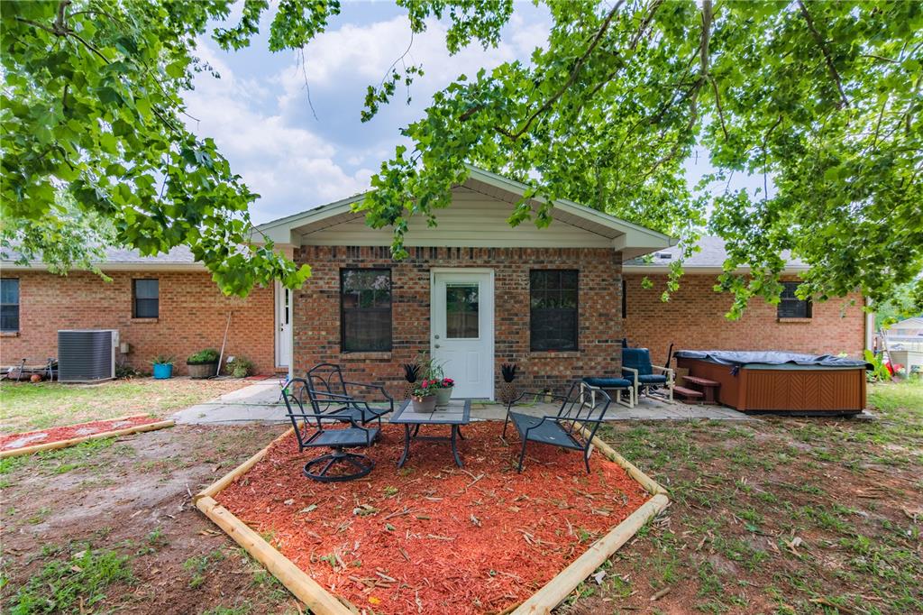 126 Southwest Mockingbird Way Lake City, FL 32024 - Photo 13 of 37 a view of a house with backyard sitting area and garden