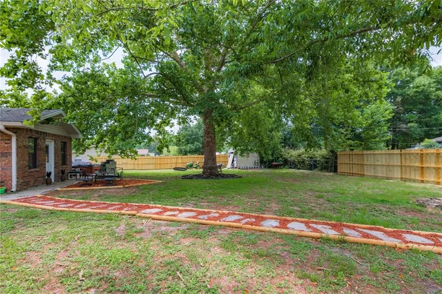 a kitchen with a sink stove and microwave