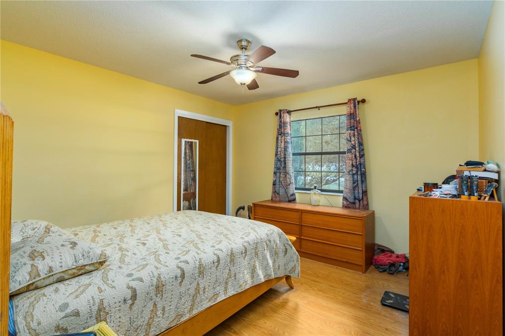 126 Southwest Mockingbird Way Lake City, FL 32024 - Photo 31 of 37 a bedroom with a bed and window