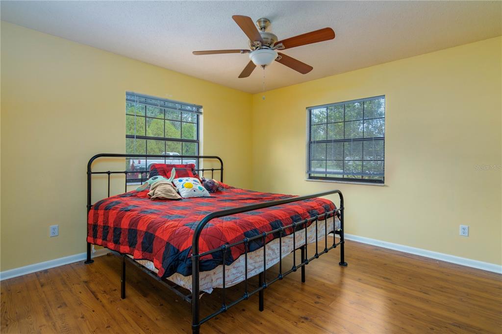 126 Southwest Mockingbird Way Lake City, FL 32024 - Photo 34 of 37 a bedroom with a bed and a window