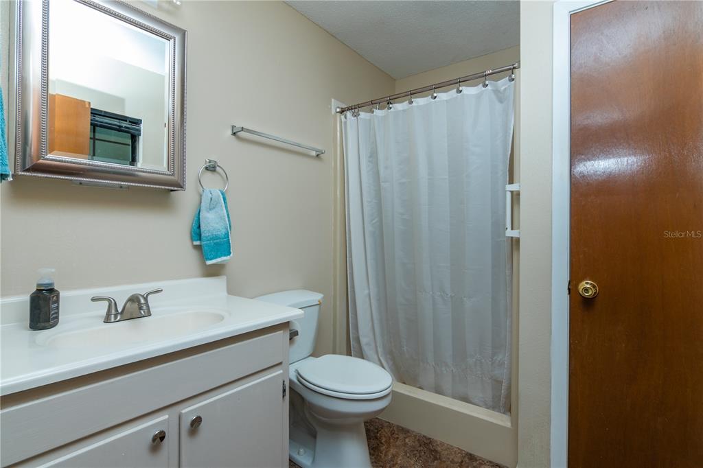 126 Southwest Mockingbird Way Lake City, FL 32024 - Photo 36 of 37 a bathroom with a sink a toilet and shower