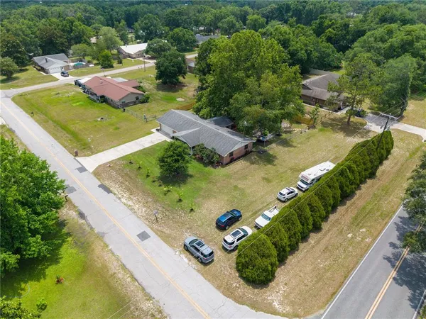 an aerial view of a residential houses with outdoor space