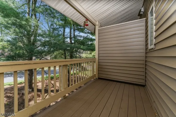 a view of a balcony with wooden floor