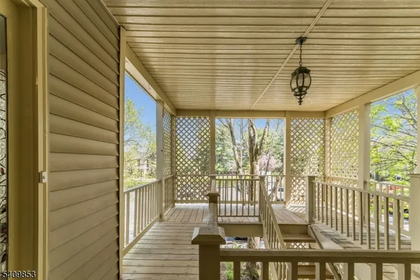 a view of a balcony with wooden floor