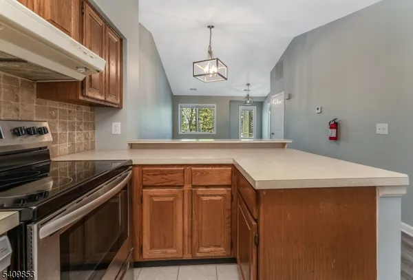 a kitchen with a stove and a microwave