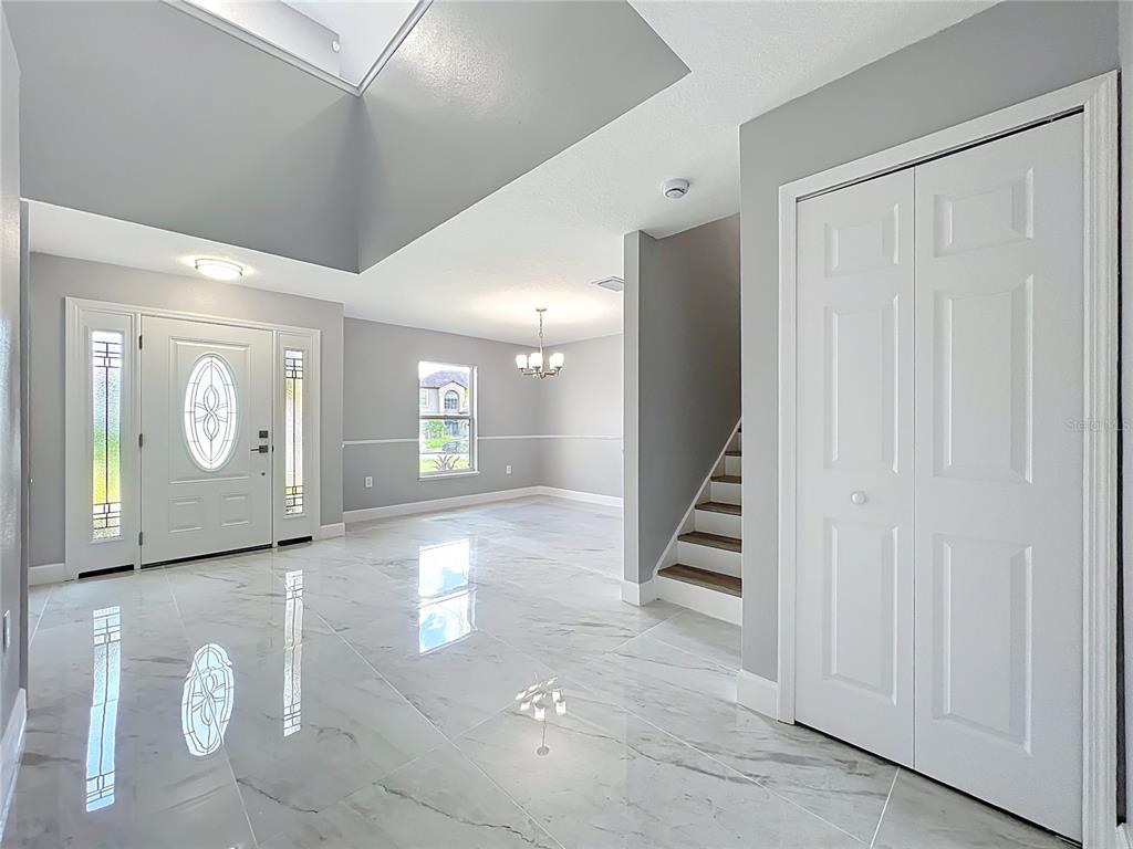 11963 Bentry Street Orlando, FL 32824 - Photo 12 of 80 a view of a hallway with seating area