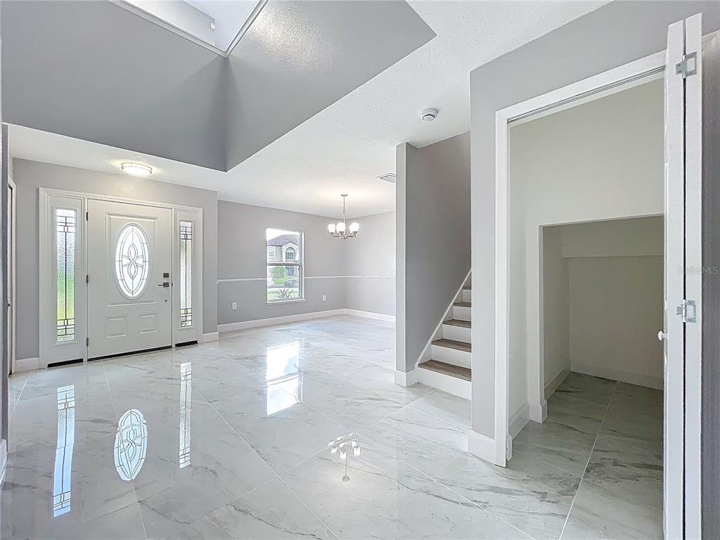 11963 Bentry Street Orlando, FL 32824 - Photo 13 of 80 a view of a hallway with staircase