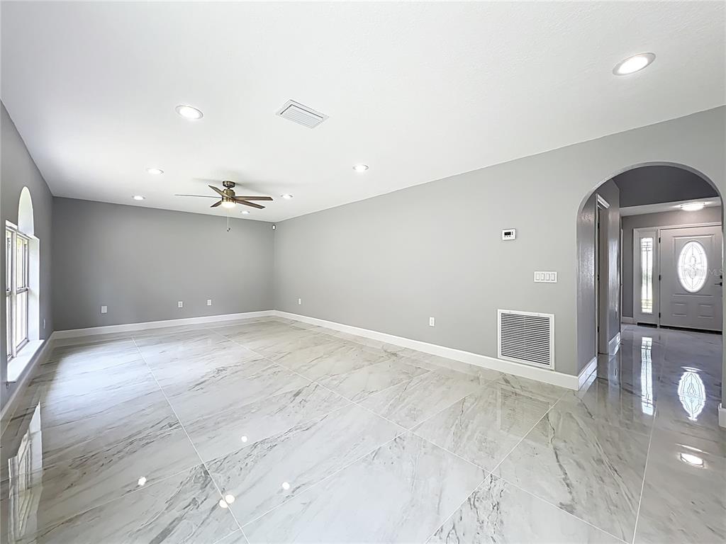 11963 Bentry Street Orlando, FL 32824 - Photo 25 of 80 wooden floor in an empty room with a window