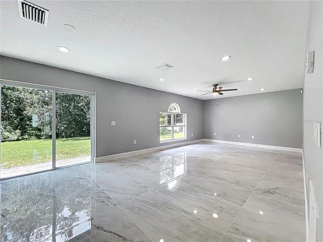 a bathroom with a double vanity sink toilet mirror and bathtub