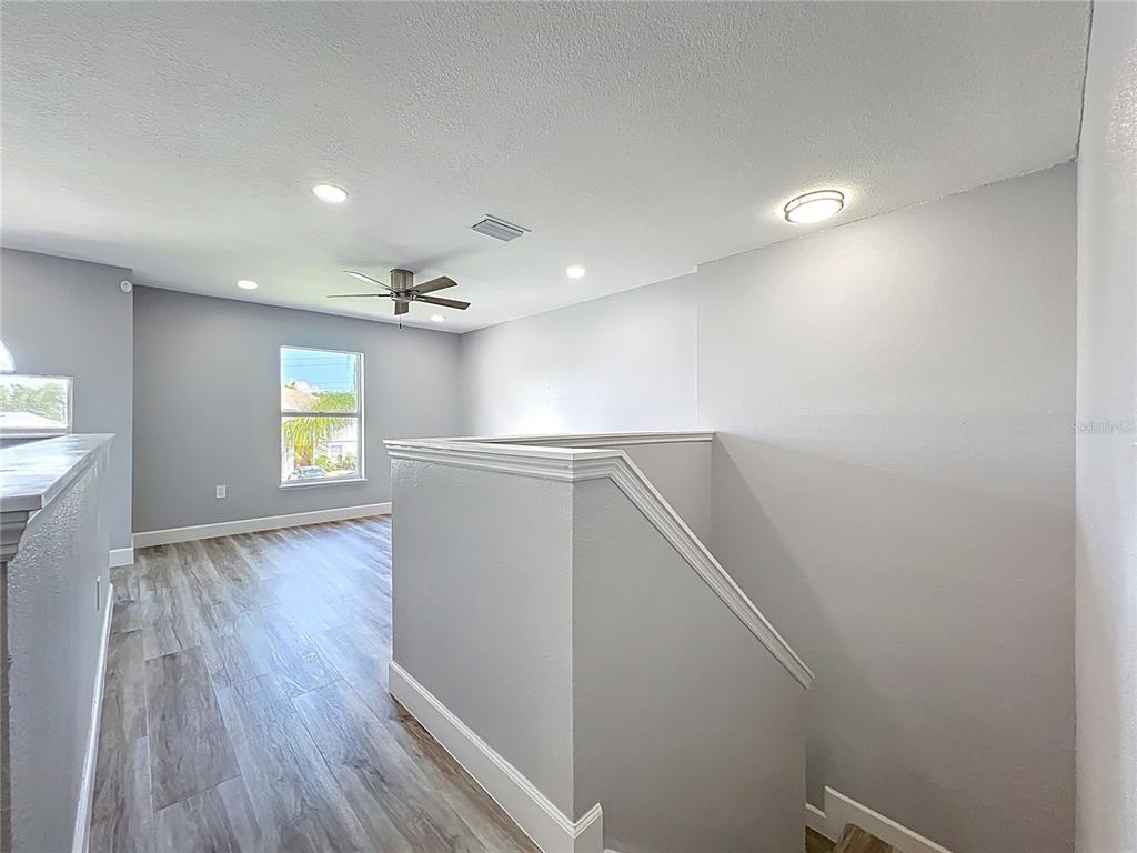 11963 Bentry Street Orlando, FL 32824 - Photo 33 of 80 a view of empty room with wooden floor