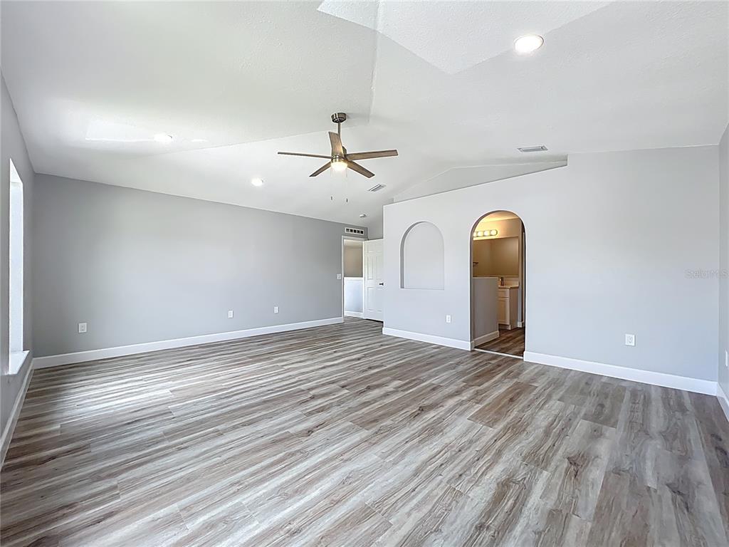 11963 Bentry Street Orlando, FL 32824 - Photo 51 of 80 wooden floor in an empty room with a window