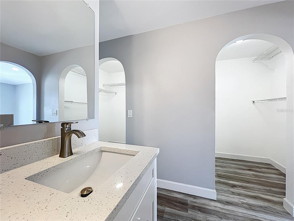 11963 Bentry Street Orlando, FL 32824 - Photo 61 of 80 a bathroom with a sink and mirror
