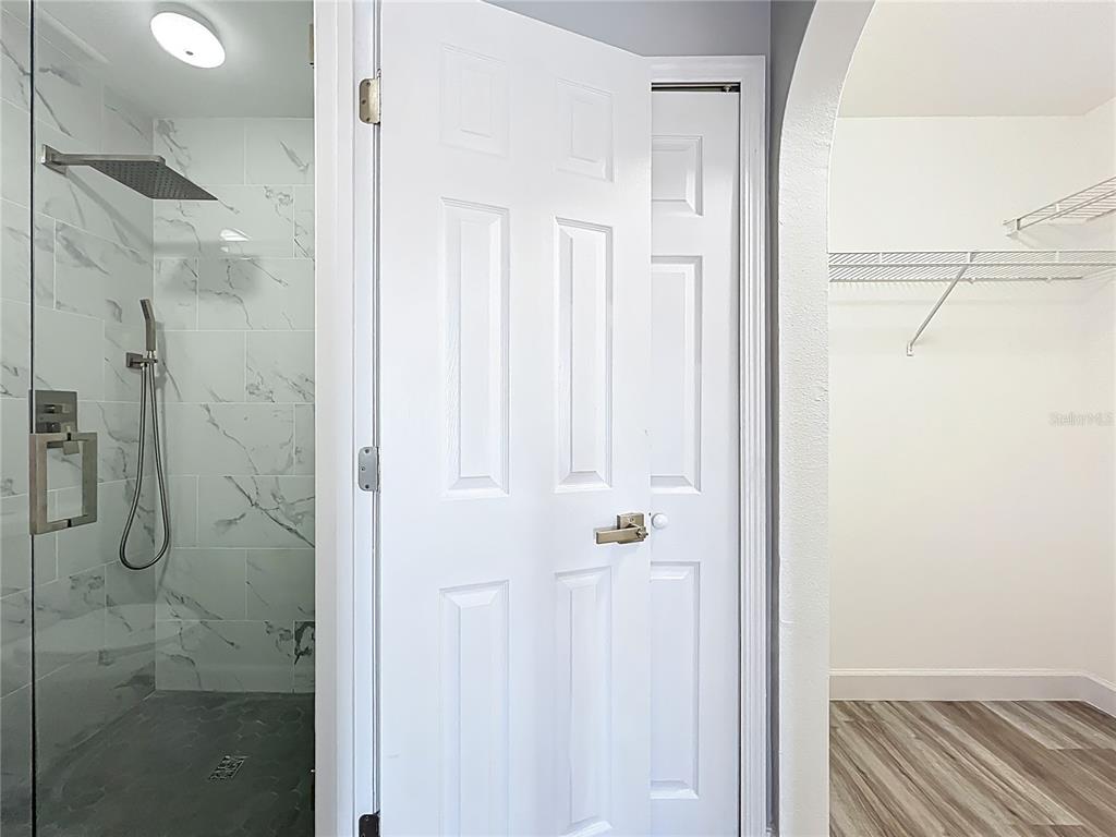 11963 Bentry Street Orlando, FL 32824 - Photo 65 of 80 a bathroom with a shower