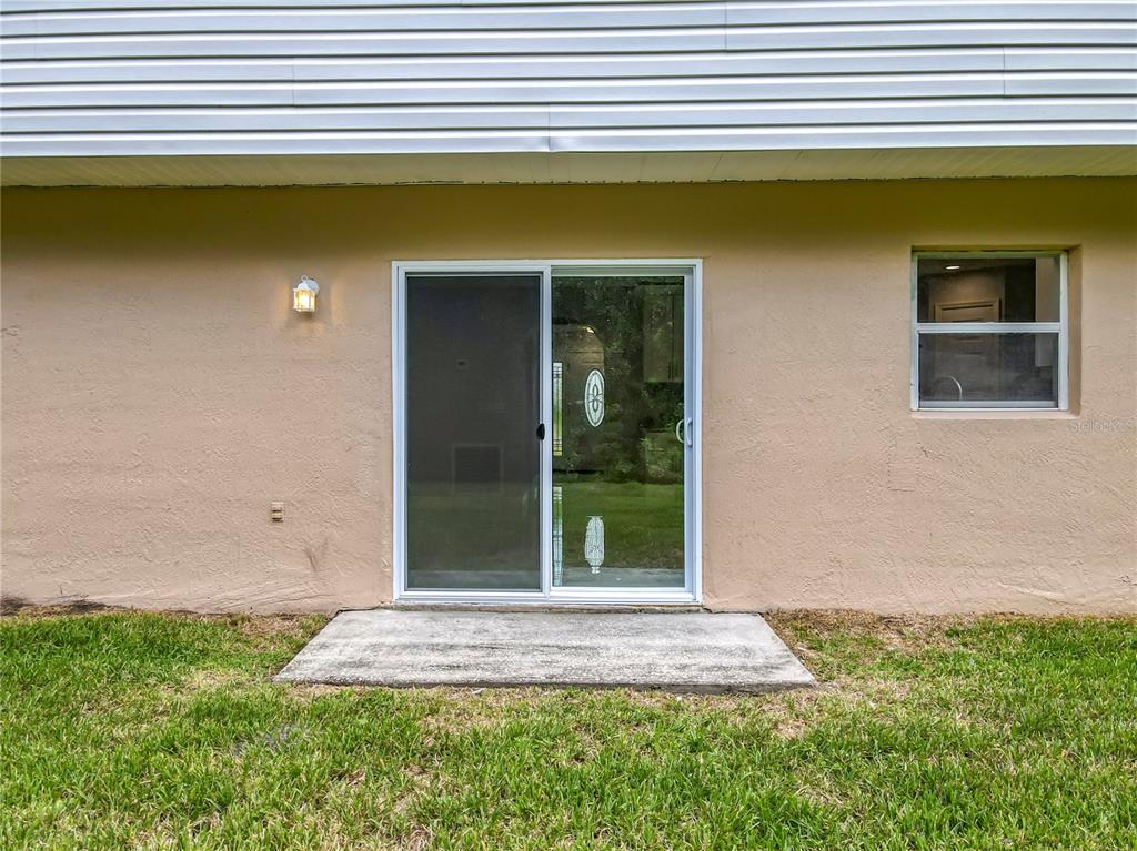 11963 Bentry Street Orlando, FL 32824 - Photo 71 of 80 a front view of a house with a yard