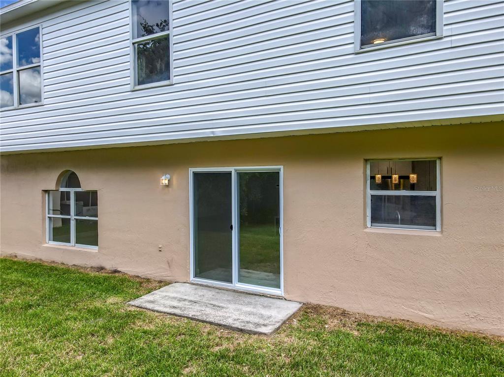 11963 Bentry Street Orlando, FL 32824 - Photo 72 of 80 a front view of a house with a yard