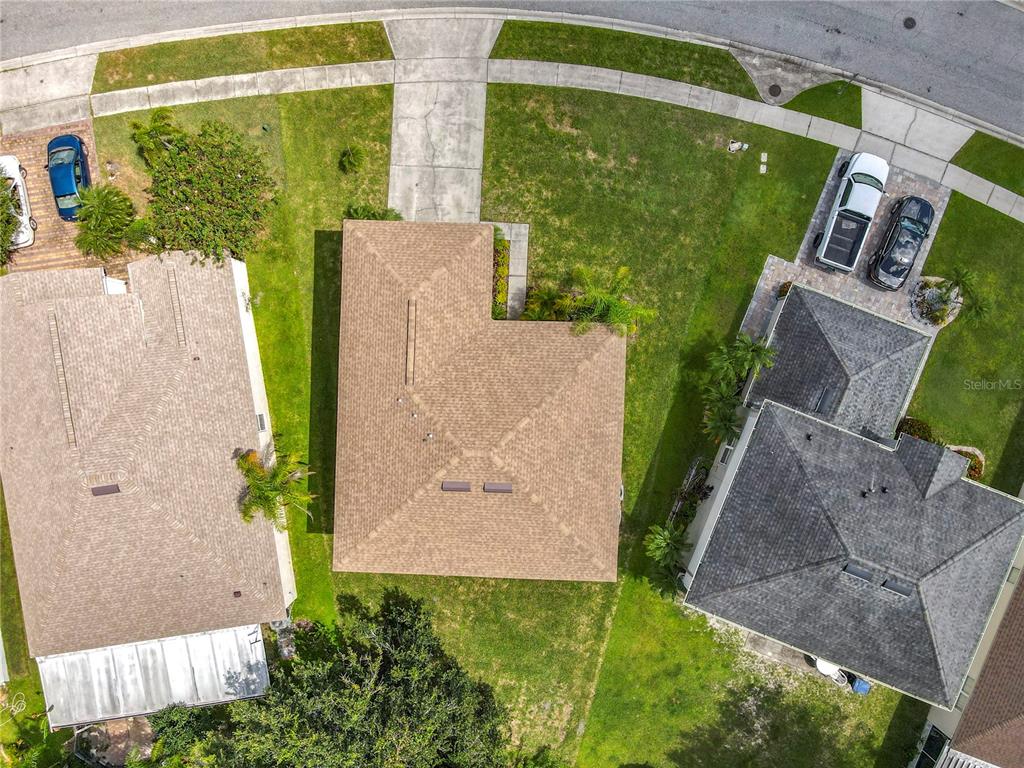 11963 Bentry Street Orlando, FL 32824 - Photo 77 of 80 an aerial view of a house with garden space and outdoor seating
