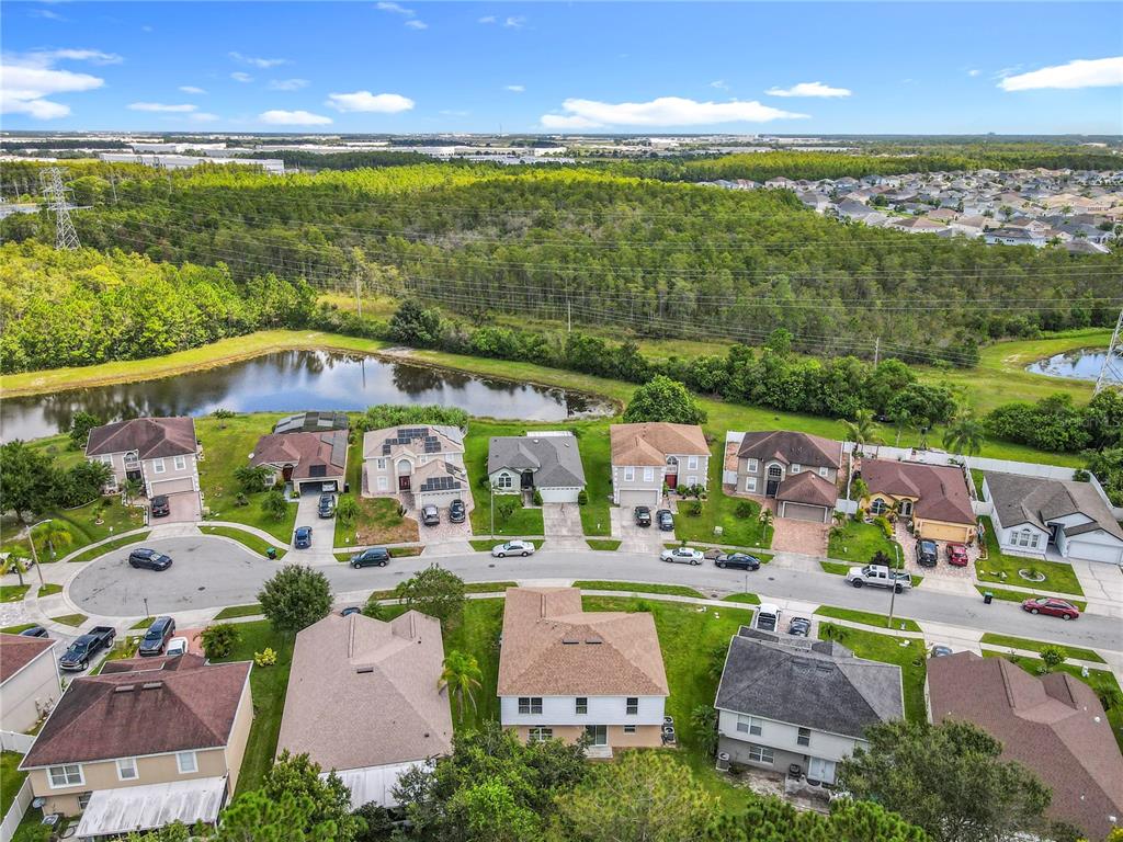 11963 Bentry Street Orlando, FL 32824 - Photo 79 of 80 an aerial view of residential houses with outdoor space and ocean view