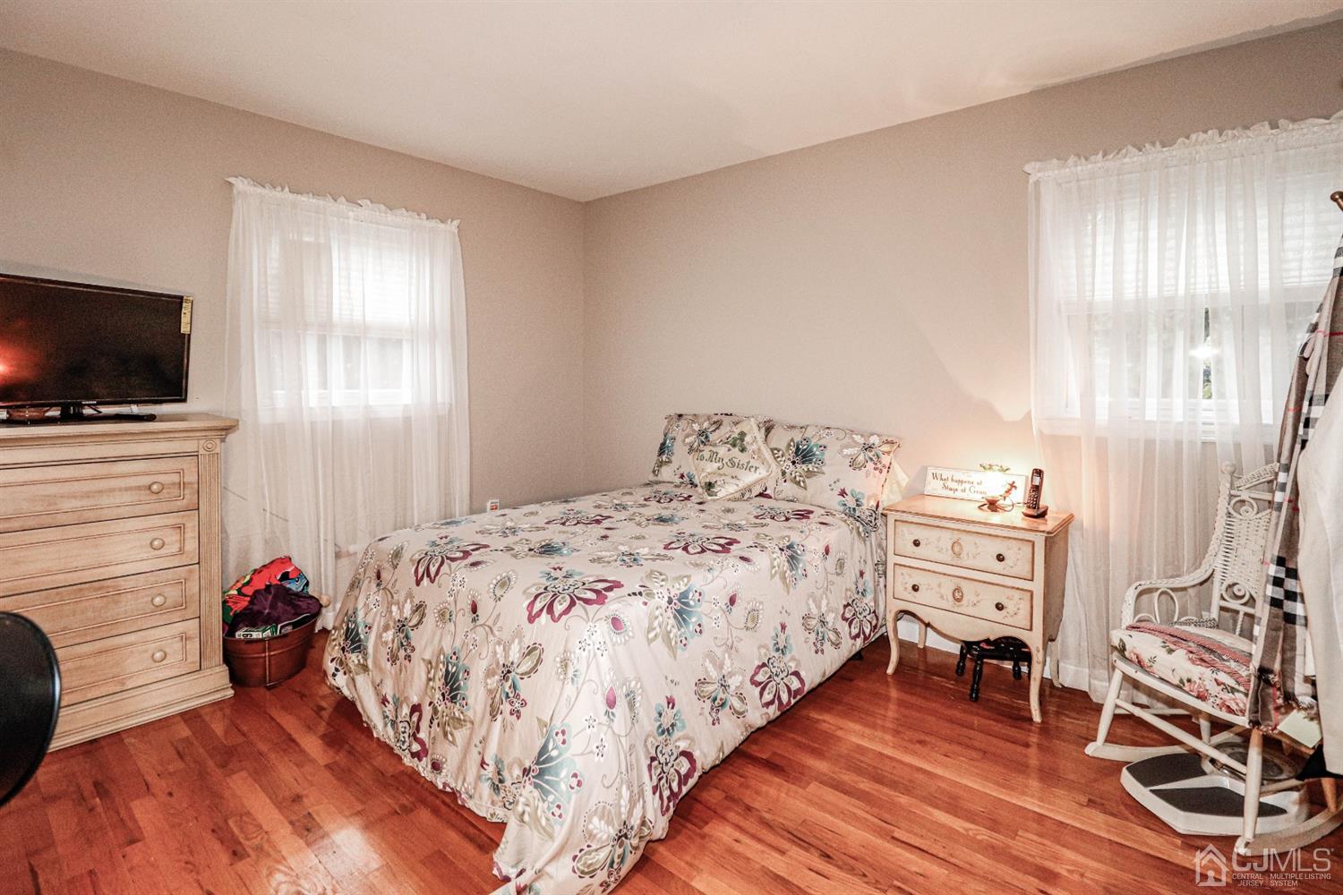 16 Phillips Road Edison, NJ 08817 - Photo 22 of 34 a bedroom with a bed and flat screen tv