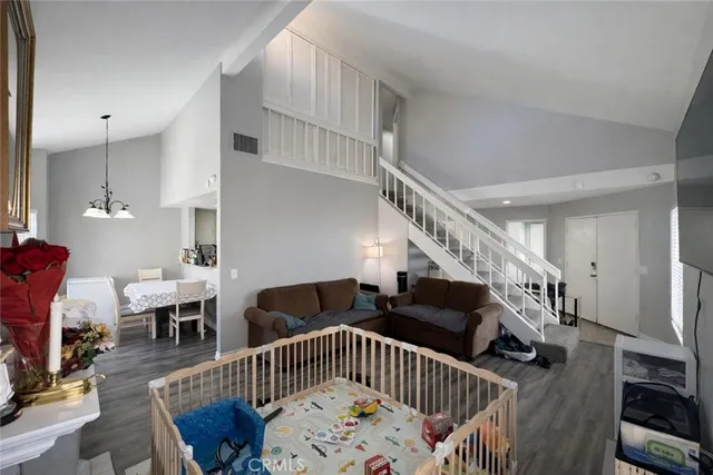 a view of entryway with wooden floor and windows