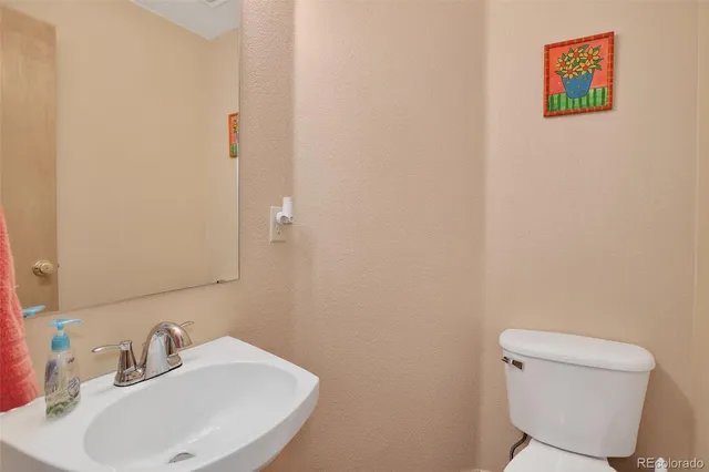 a bathroom with a toilet and a sink