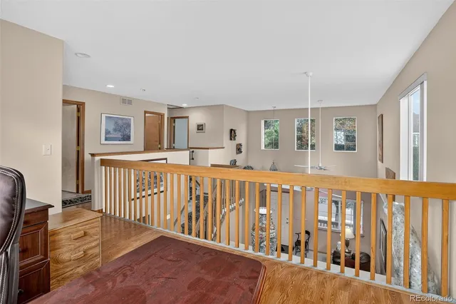 a view of a porch with wooden floor and windows