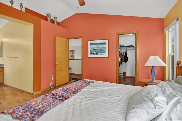 a bedroom with a bed and a lamp