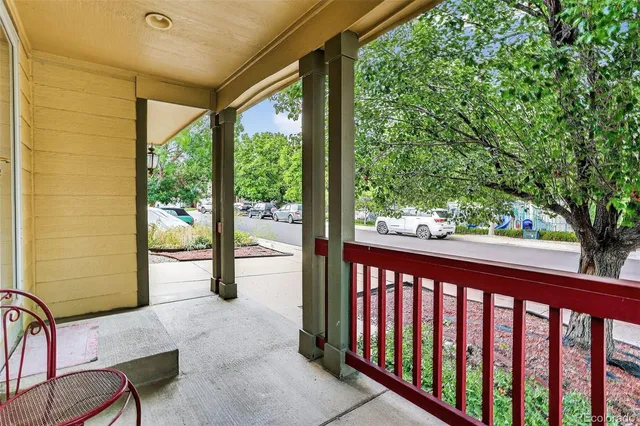 a view of a balcony with chairs