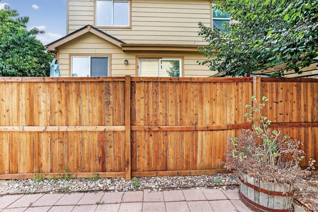 a view of a house with a window and yard