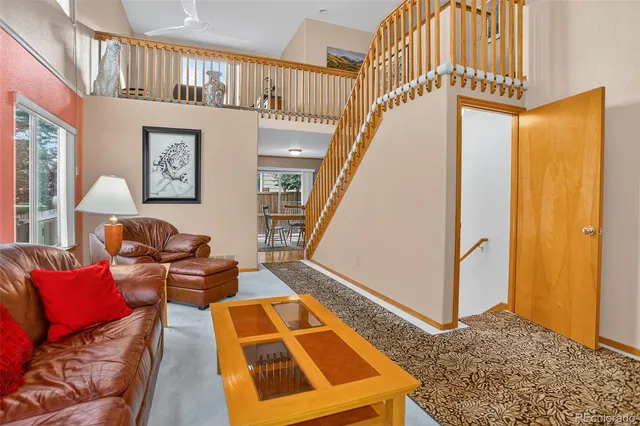 a living room with furniture and a rug