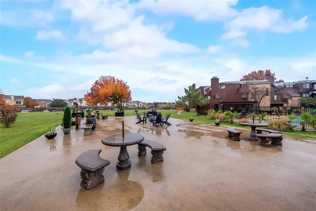 a view of a swimming pool and lounge chairs